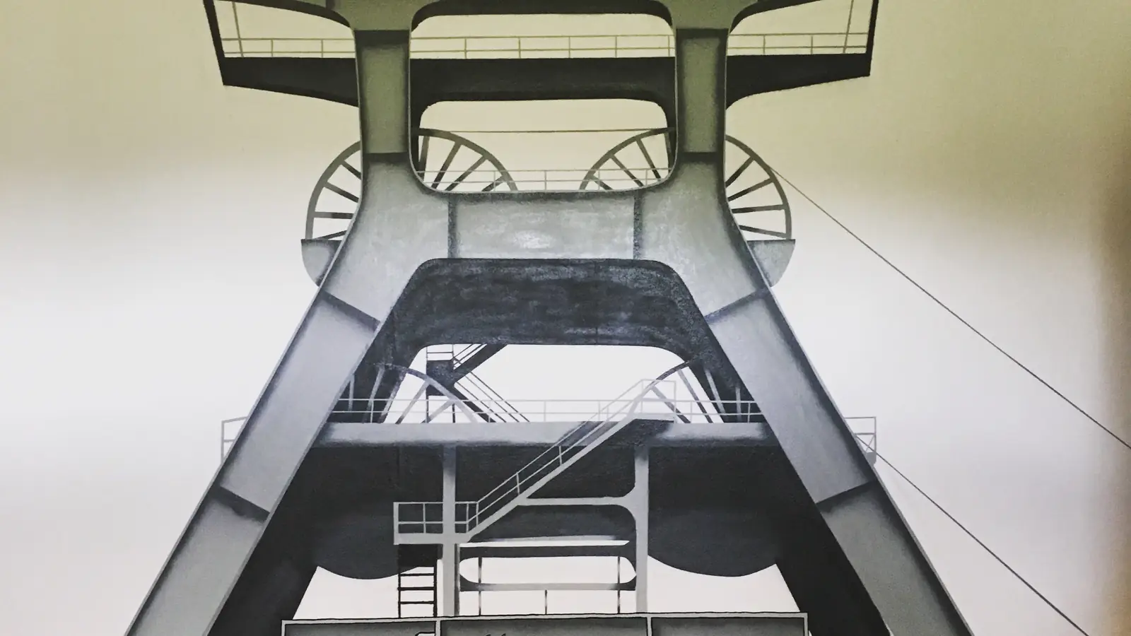 Fördergerüst der Zeche Zollverein in Grautönen, als Wandbild gesprüht von Dagobert Lack